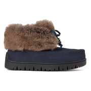 Navy winter boot with brown fur trim on a white background